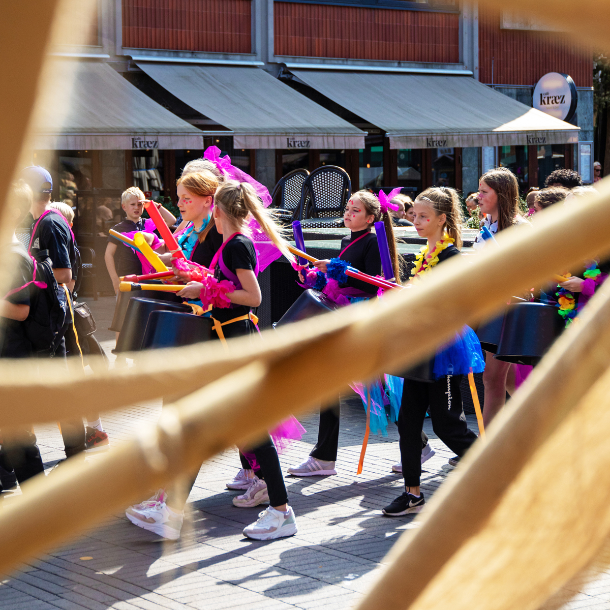 Children playing samba in the streets.